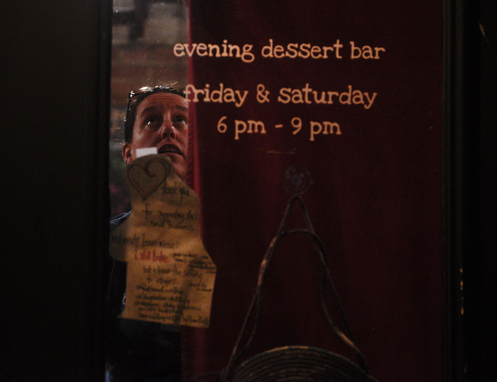 Rostine draws the curtains to the doors of Good Food Co.